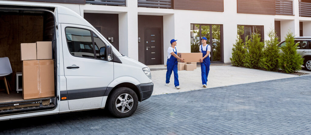 moving companies with movers two men carrying a box